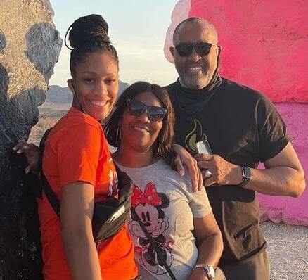 Eva Rakes Wilson with her husband Roscoe C. Wilson Jr. and daughter A’ja Wilson.